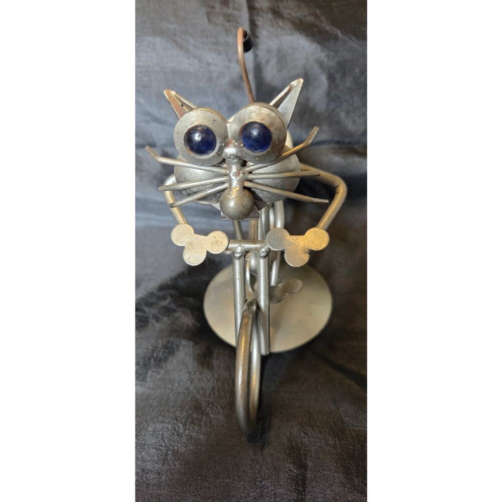 Metal Cat Sculpture Riding a Bike